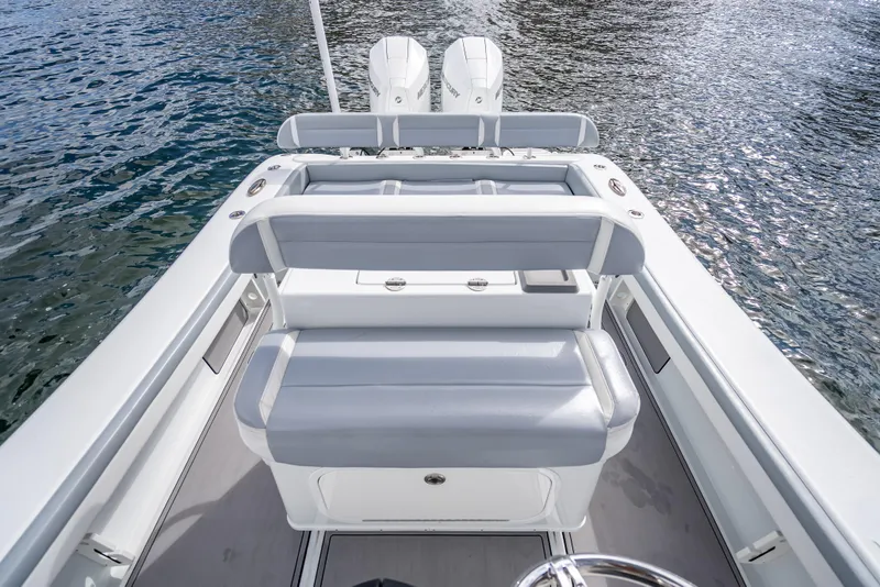 Slide: The Image of 2021 Yellowfin 26 Hybrid boat interior with dual engines on water. - 36