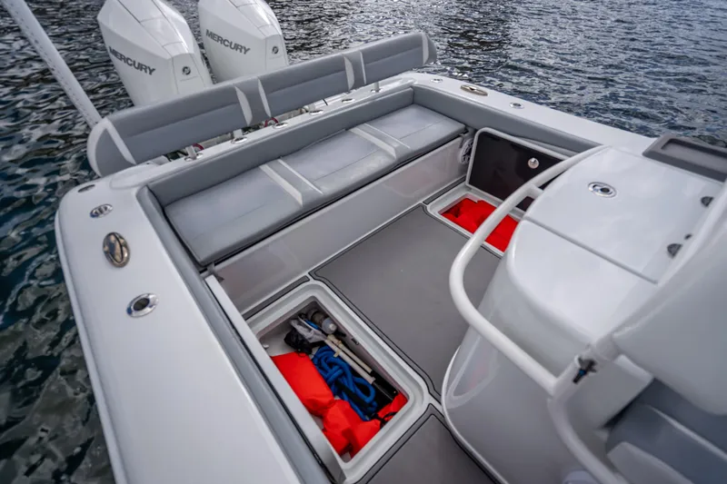Slide: The Image of 2021 Yellowfin 26 Hybrid boat interior with storage compartments and Mercury engines. - 39