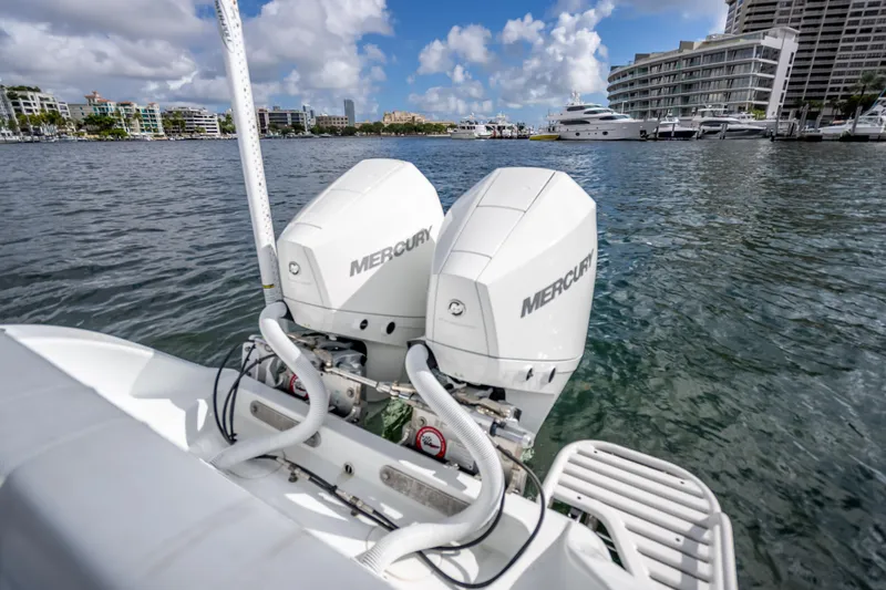 Slide: The Image of 2021 Yellowfin 26 Hybrid boat with dual Mercury outboard engines on a sunny day. - 41