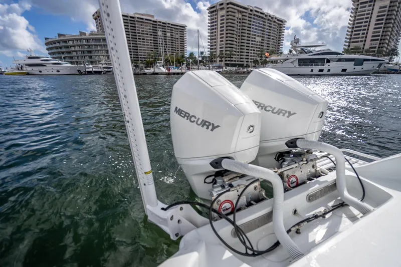 Slide: The Image of 2021 Yellowfin 26 Hybrid boat with dual Mercury engines docked in marina. - 42