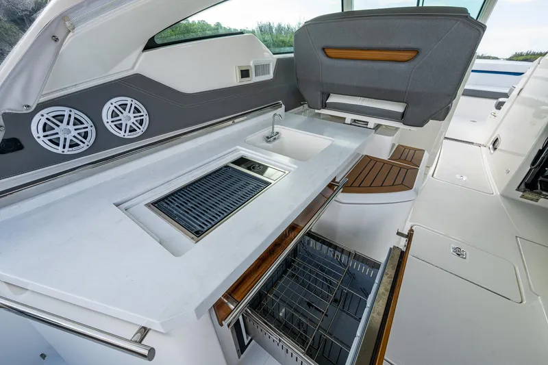 Slide: The Image of 2021 Tiara Yachts 38 LX interior with sleek kitchen and modern amenities. - 17