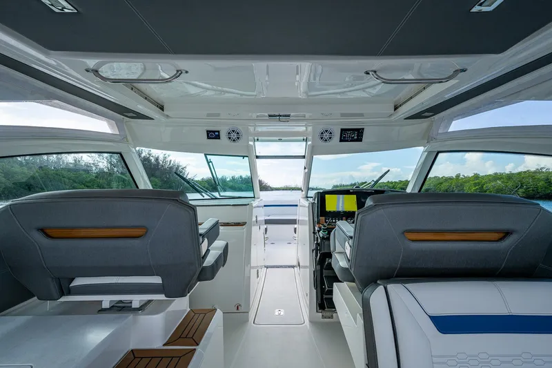 Slide: The Image of Interior view of 2021 Tiara Yachts 38 LX cockpit with modern seating and controls. - 26