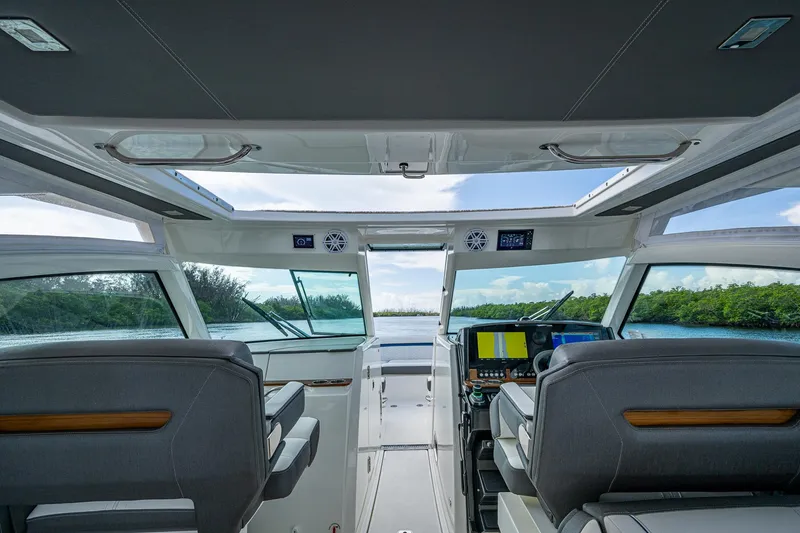 Slide: The Image of Interior view of 2021 Tiara Yachts 38 LX, featuring modern helm and seating. - 29