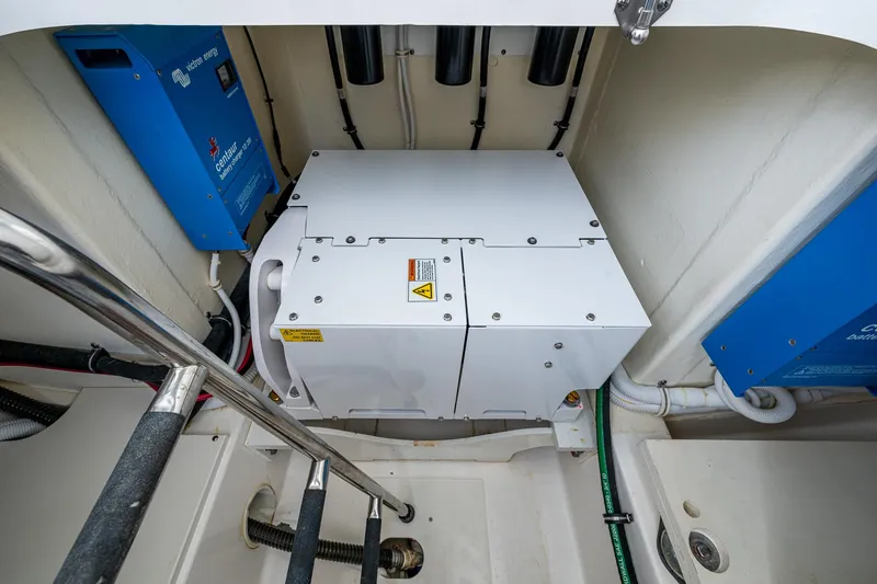 Slide: The Image of Engine compartment of 2021 Tiara Yachts 38 LX, featuring electrical components and wiring. - 31