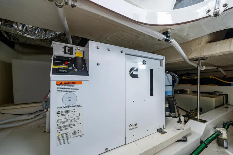 Slide: The Image of Engine room of 2021 Tiara Yachts 38 LX with Cummins Onan Marine generator. - 33