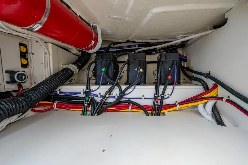 Slide: The Image of Engine compartment of 2021 Tiara Yachts 38 LX, showcasing wiring and components. - 34