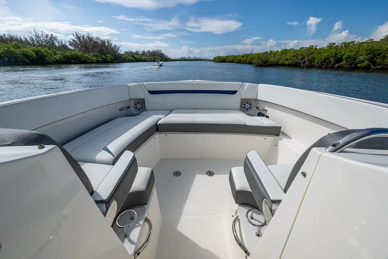 Slide: The Image of 2021 Tiara Yachts 38 LX interior with seating, on a scenic waterway. - 35