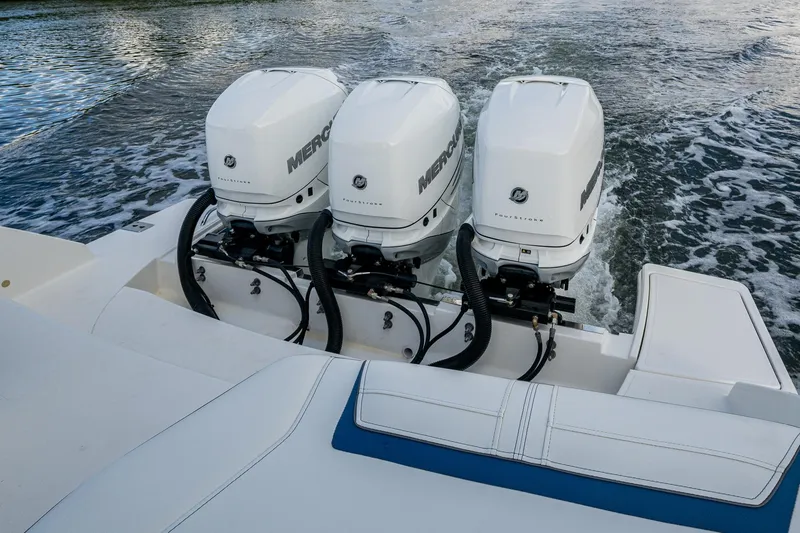Slide: The Image of Triple Mercury outboard engines on 2021 Tiara Yachts 38 LX, cruising on water. - 41