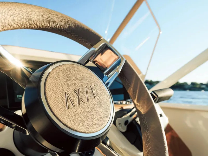 Slide: The Image of Steering wheel of 2025 Axopar AX/E 22 T-Top boat, close-up view. - 5