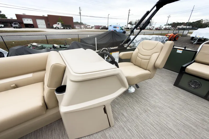 Slide: The Image of 2026 Godfrey Sweetwater Xperience 20' pontoon boat interior with beige seating and helm. - 5