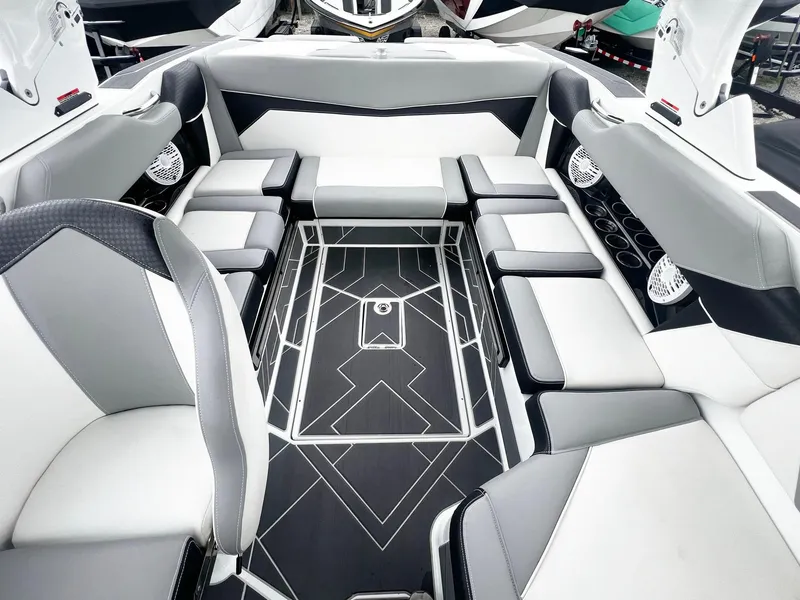 Slide: The Image of 2023 Supreme S220 boat interior with modern seating and sleek design. - 12
