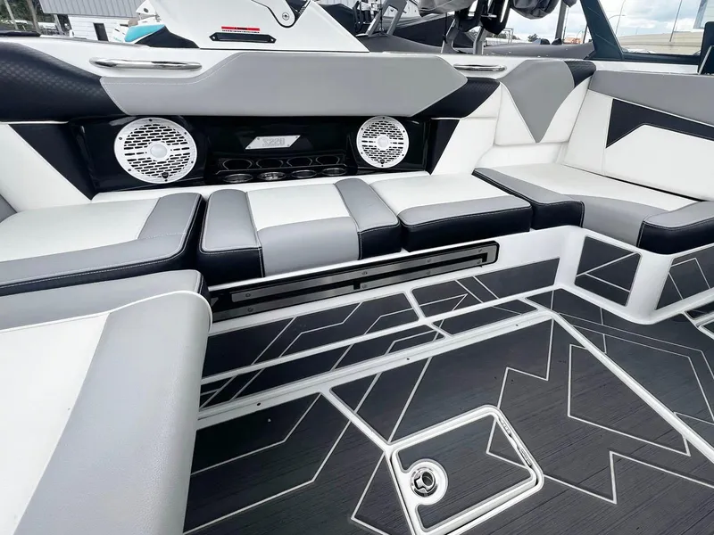 Slide: The Image of 2023 Supreme S220 boat interior with modern seating and audio system. - 5