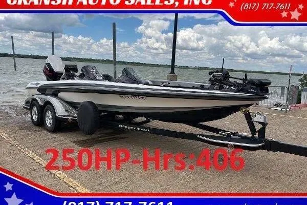 Slide: The Image of 2007 Ranger Z22 Comanche boat with 250HP engine, parked by a lake. - 1