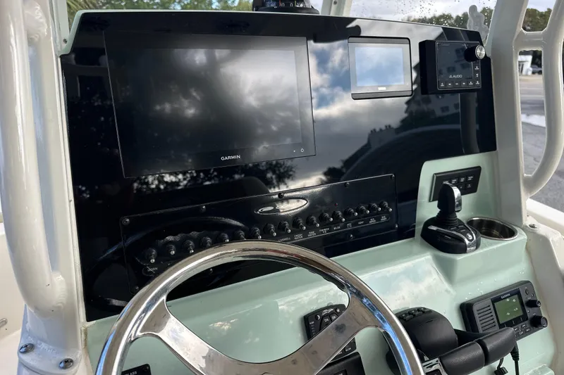 Slide: The Image of 2023 Cobia 240 Center Console dashboard with Garmin display and controls. - 15