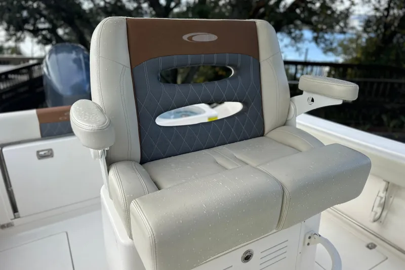 Slide: The Image of 2023 Cobia 240 Center Console boat seat with armrests, featuring a stylish design. - 17