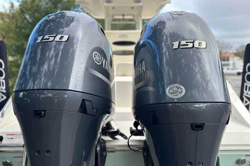 Slide: The Image of Twin Yamaha 150 engines on a 2023 Cobia 240 Center Console boat. - 8