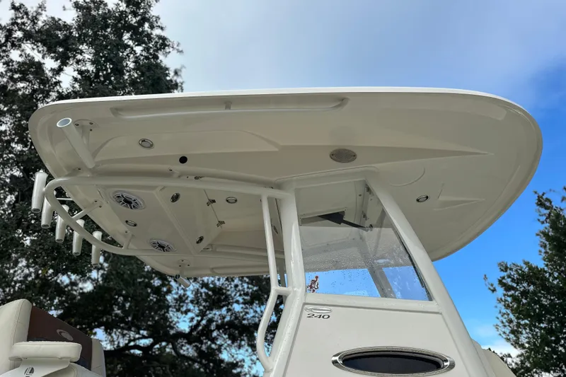 Slide: The Image of 2023 Cobia 240 Center Console boat, viewed from below, showcasing its sleek design and structure. - 9