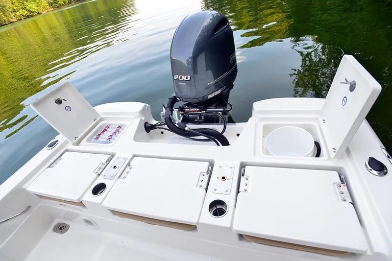 Slide: The Image of Manufacturer Provided Image: 2021 NauticStar 227 XTS boat with Yamaha 200 outboard motor on calm water. - 10