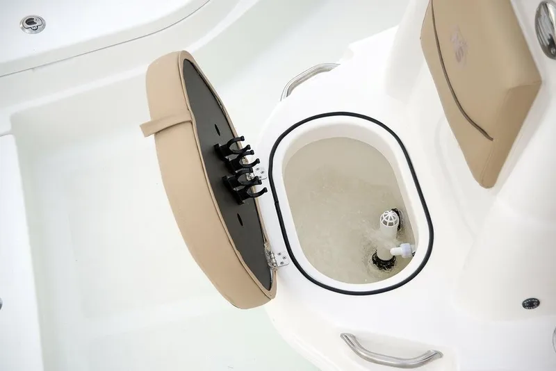 Slide: The Image of Manufacturer Provided Image: 2021 NauticStar 227 XTS boat livewell with open lid and beige seating. - 12