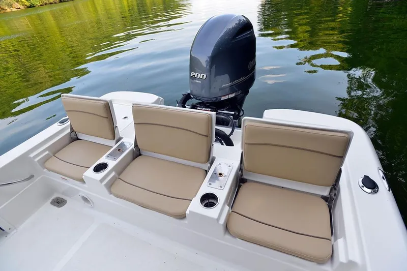 Slide: The Image of Manufacturer Provided Image: 2021 NauticStar 227 XTS boat with Yamaha 200 engine and three beige seats. - 9