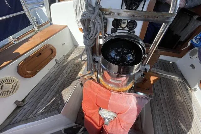Slide: The Image of Cockpit of 1982 Formosa 42 sailboat with compass and nautical equipment. - 16