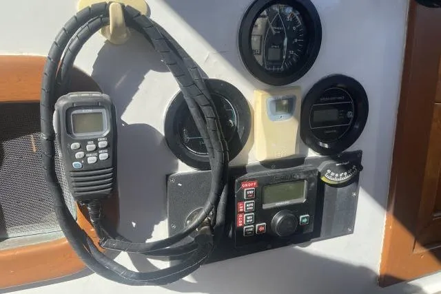 Slide: The Image of Control panel of a 1982 Formosa 42 sailboat with gauges and radio equipment. - 17