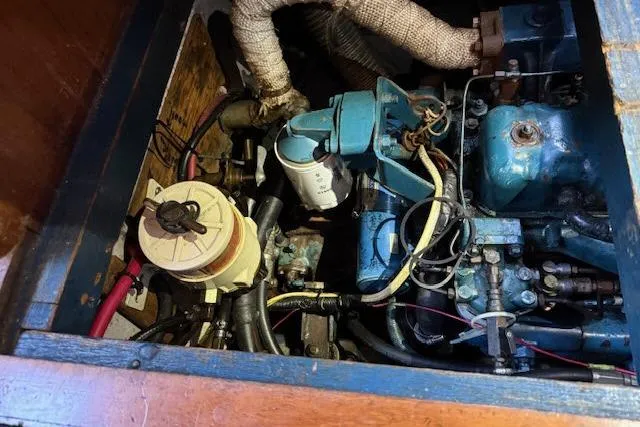 Slide: The Image of 1982 Formosa 42 engine compartment with visible wiring and components. - 25