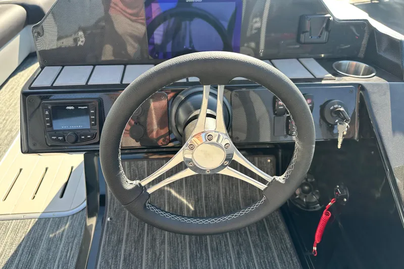 Slide: The Image of Steering wheel and dashboard of 2026 Premier 250 SunSation RF boat. - 11