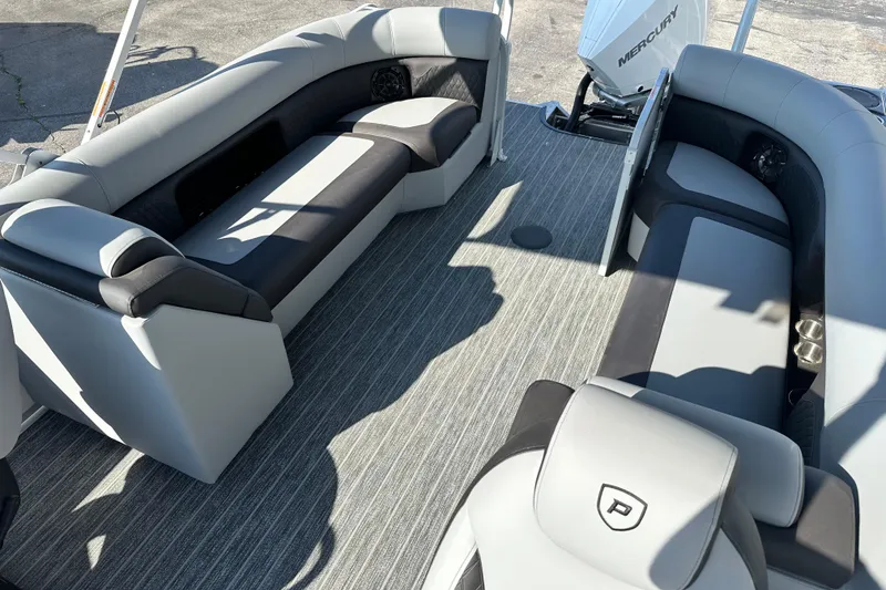 Slide: The Image of Interior of 2026 Premier 250 SunSation RF pontoon boat with gray seating and Mercury engine. - 14