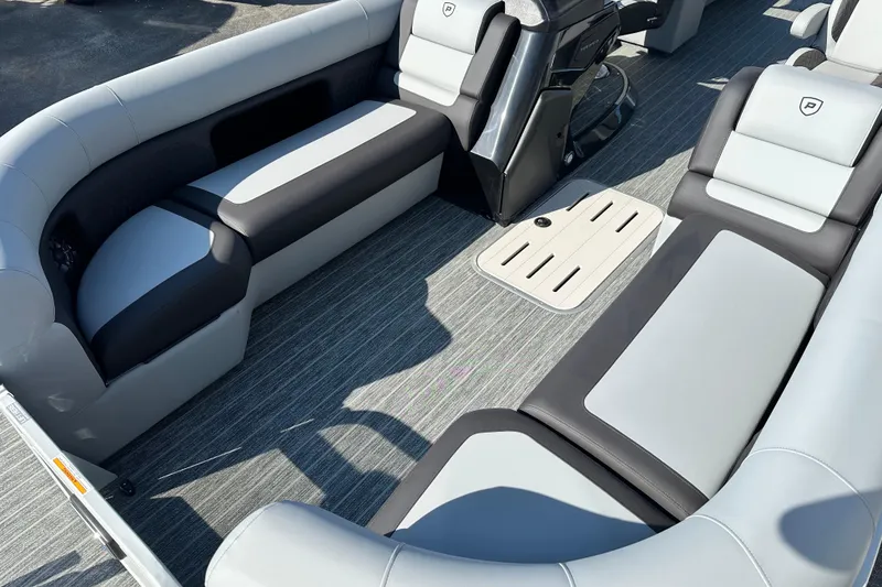 Slide: The Image of Luxurious seating on 2026 Premier 250 SunSation RF pontoon boat, featuring sleek gray upholstery. - 9