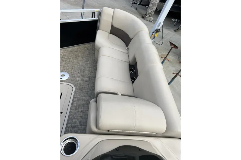 Slide: The Image of Luxurious seating on 2022 SunCatcher Fusion 324SS pontoon boat, featuring beige upholstery. - 10