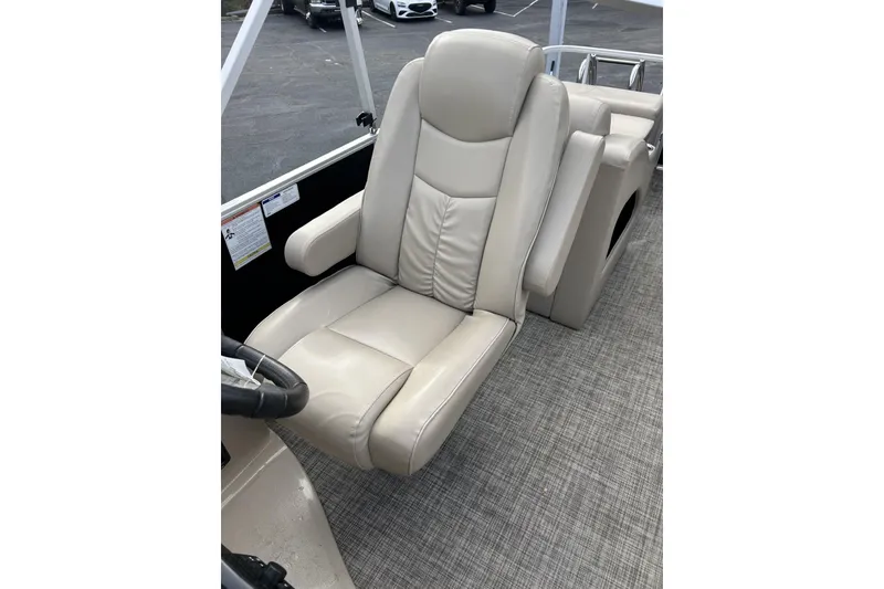 Slide: The Image of Luxurious beige captain's chair on 2022 SunCatcher Fusion 324SS boat. - 12