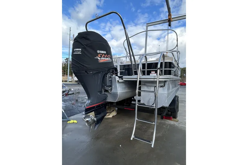 Slide: The Image of 2022 SunCatcher Fusion 324SS boat with Yamaha SHO VMAX engine, ladder, and trailer. - 13