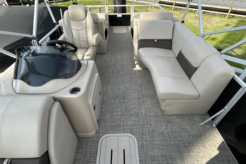 Slide: The Image of 2022 SunCatcher Fusion 324SS pontoon boat interior with plush seating and modern helm. - 3