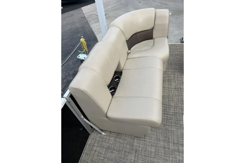 Slide: The Image of Beige seating on 2022 SunCatcher Fusion 324SS boat, featuring cup holders and durable flooring. - 9