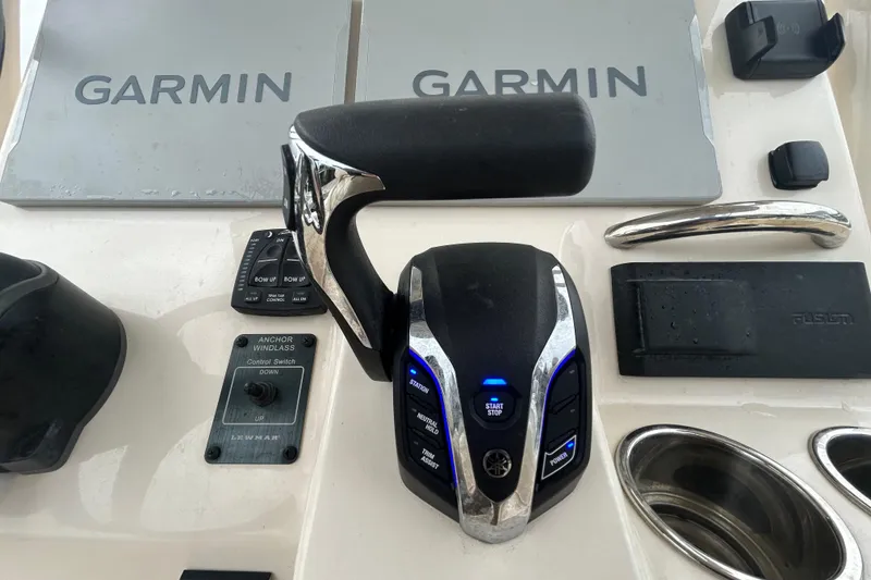 Slide: The Image of Control panel of 2025 Grady-White Fisherman 236 with Garmin navigation and Yamaha throttle. - 18