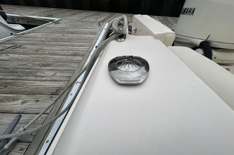 Slide: The Image of 2025 Grady-White Fisherman 236 boat detail with dock and Yamaha engine. - 27
