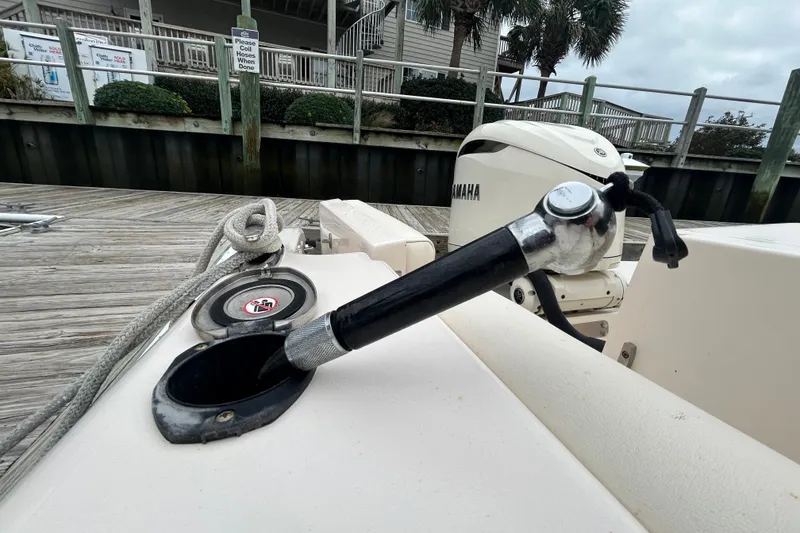 Slide: The Image of Fuel hose on a 2025 Grady-White Fisherman 236 boat docked with Yamaha engine. - 28