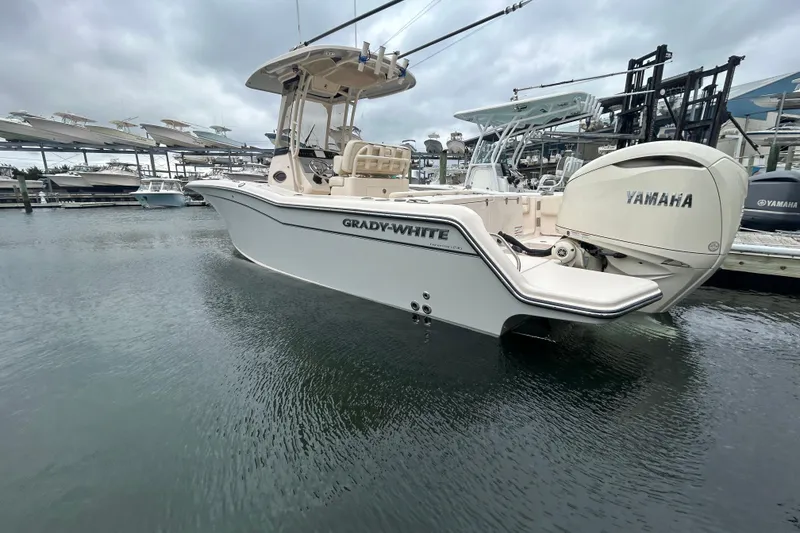 Slide: The Image of 2025 Grady-White Fisherman 236 boat with Yamaha engine docked at marina. - 29