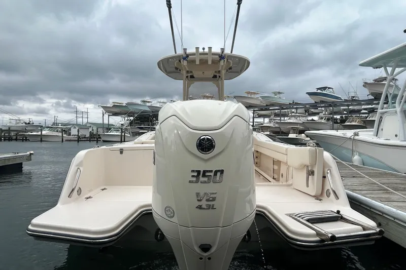 Slide: The Image of 2025 Grady-White Fisherman 236 boat with powerful 350 V6 engine at marina. - 3