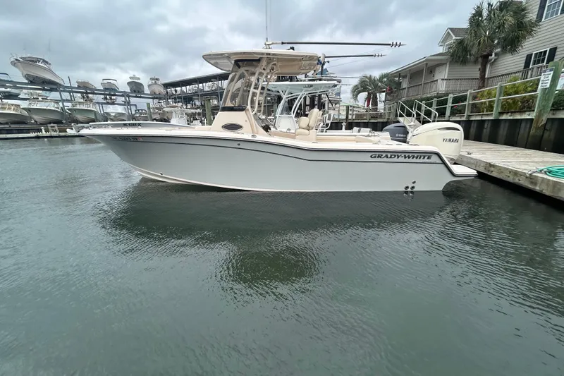 Slide: The Image of 2025 Grady-White Fisherman 236 boat docked in marina, overcast sky. - 30