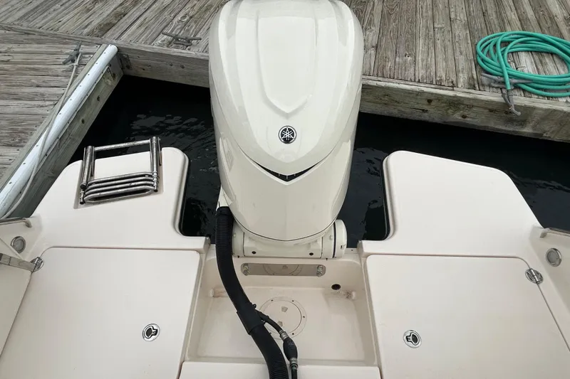 Slide: The Image of 2025 Grady-White Fisherman 236 boat with outboard motor at dock. - 4