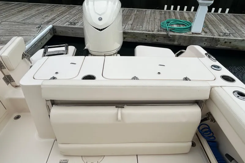 Slide: The Image of 2025 Grady-White Fisherman 236 boat interior with seating and storage compartments. - 6