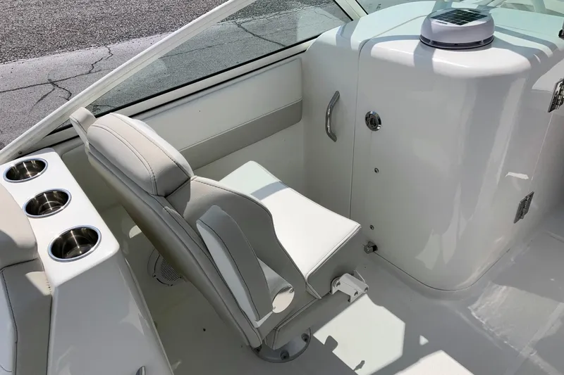 Slide: The Image of Interior of 2026 World Cat 230 SD boat with seating and cup holders. - 13