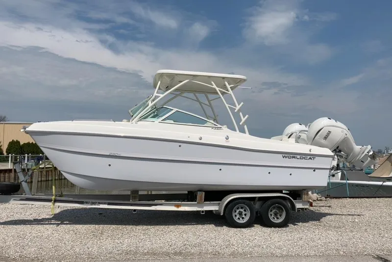The Image of 2026 World Cat 230 SD boat on trailer, featuring dual outboard engines. - 0
