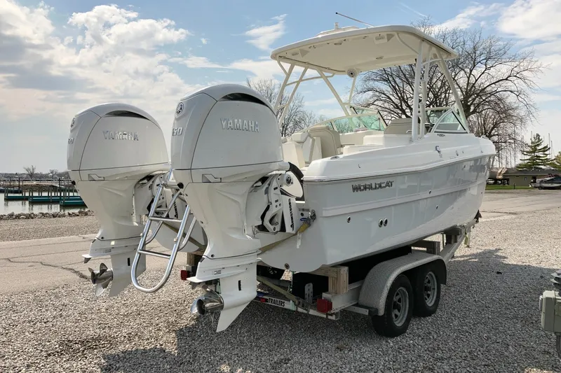 Slide: The Image of 2026 World Cat 230 SD boat with twin Yamaha engines on a trailer. - 2