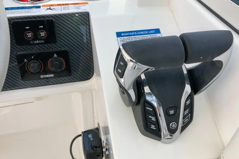 Slide: The Image of Control panel of 2026 World Cat 230 SD boat with Yamaha throttle system. - 7