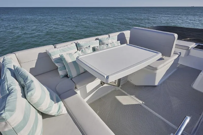 Slide: The Image of Luxurious seating area on 2026 Beneteau Antares 12 Fly OB yacht with ocean view. - 5