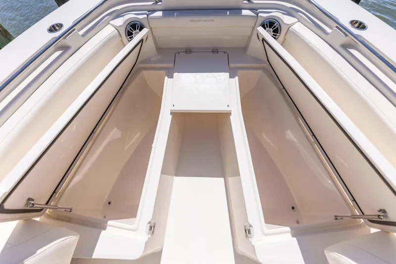 Slide: The Image of 2022 Grady-White Canyon 336 boat interior with open storage compartments. - 12