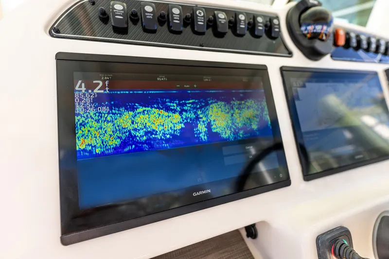 Slide: The Image of Dashboard of 2022 Grady-White Canyon 336 with Garmin fishfinder display. - 21
